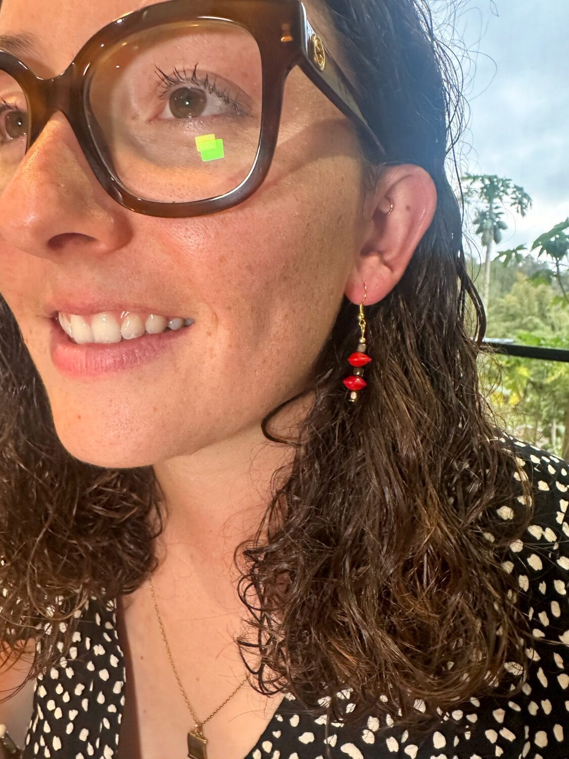 lady modelling red sandalwood earrings