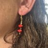 lady modelling red sandalwood earrings
