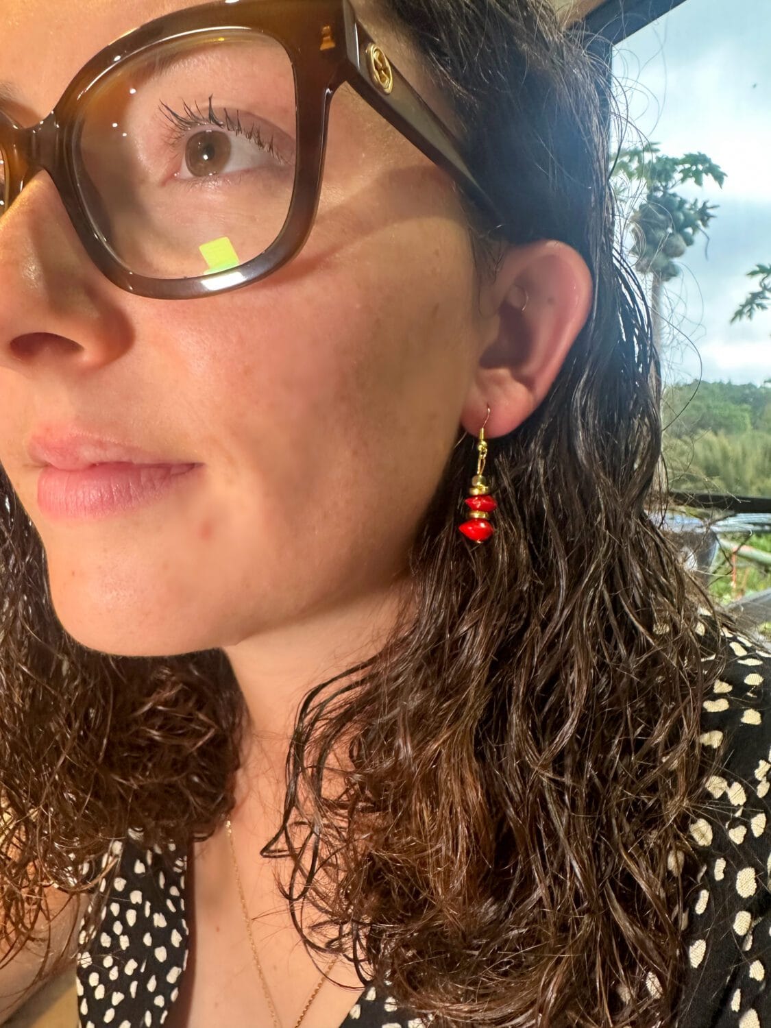 lady modelling red sandalwood earrings