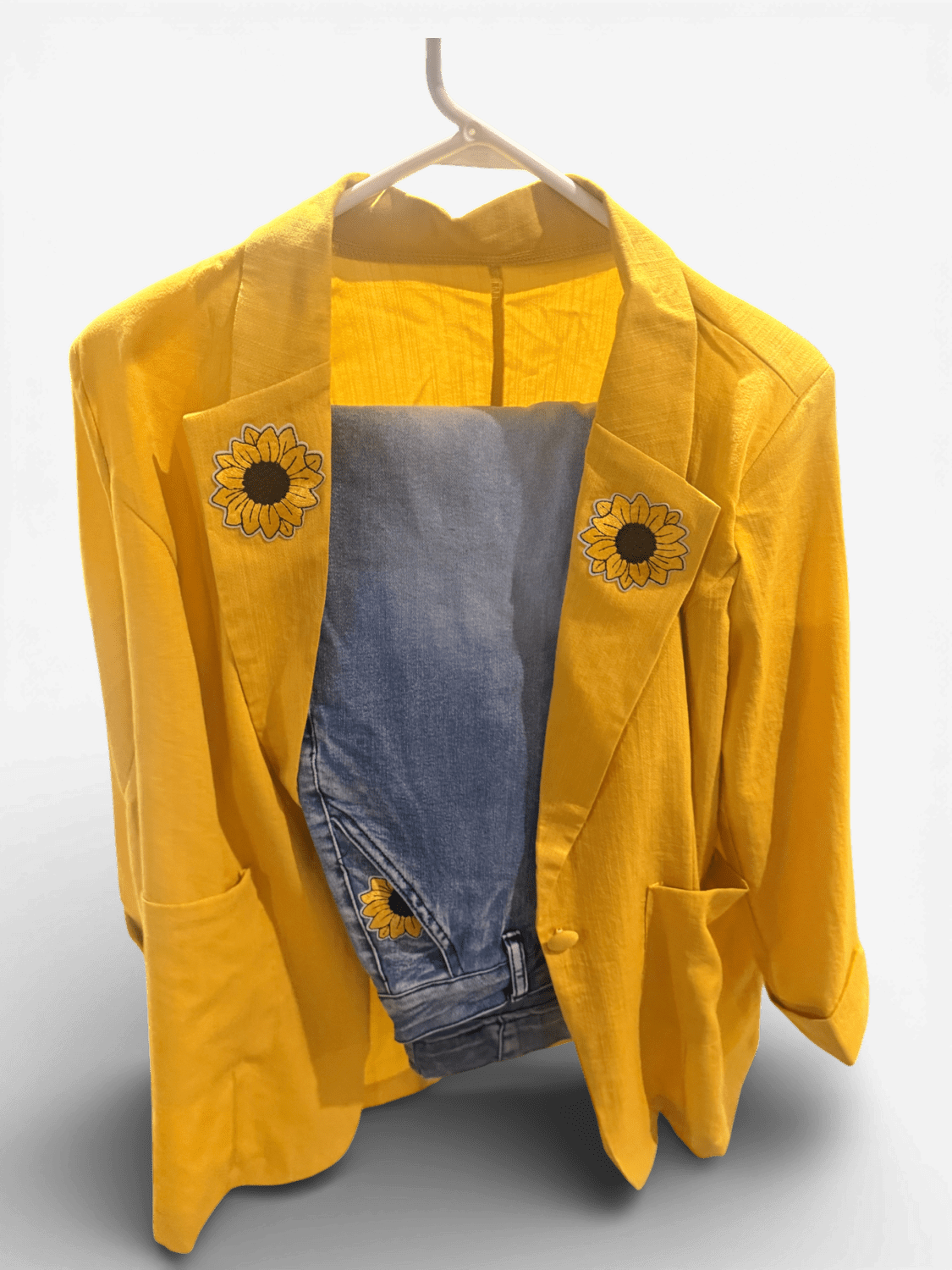 IMG_8029 10 Bright yellow blazer on a hanger with denim inner lining and sunflower patches on the lapels.