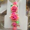 IMG_9190 Bracelet with pink gradient rose beads and green leaves on white carding surface.