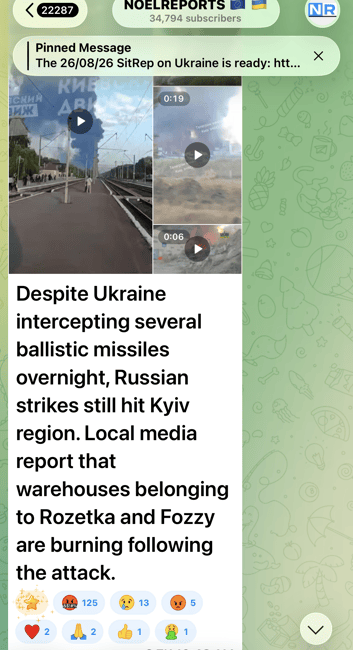 Screenshot of a chat feed sharing a news article about Ukraine intercepting ballistic missiles, with video thumbnail previews and emoji reactions below the headline.